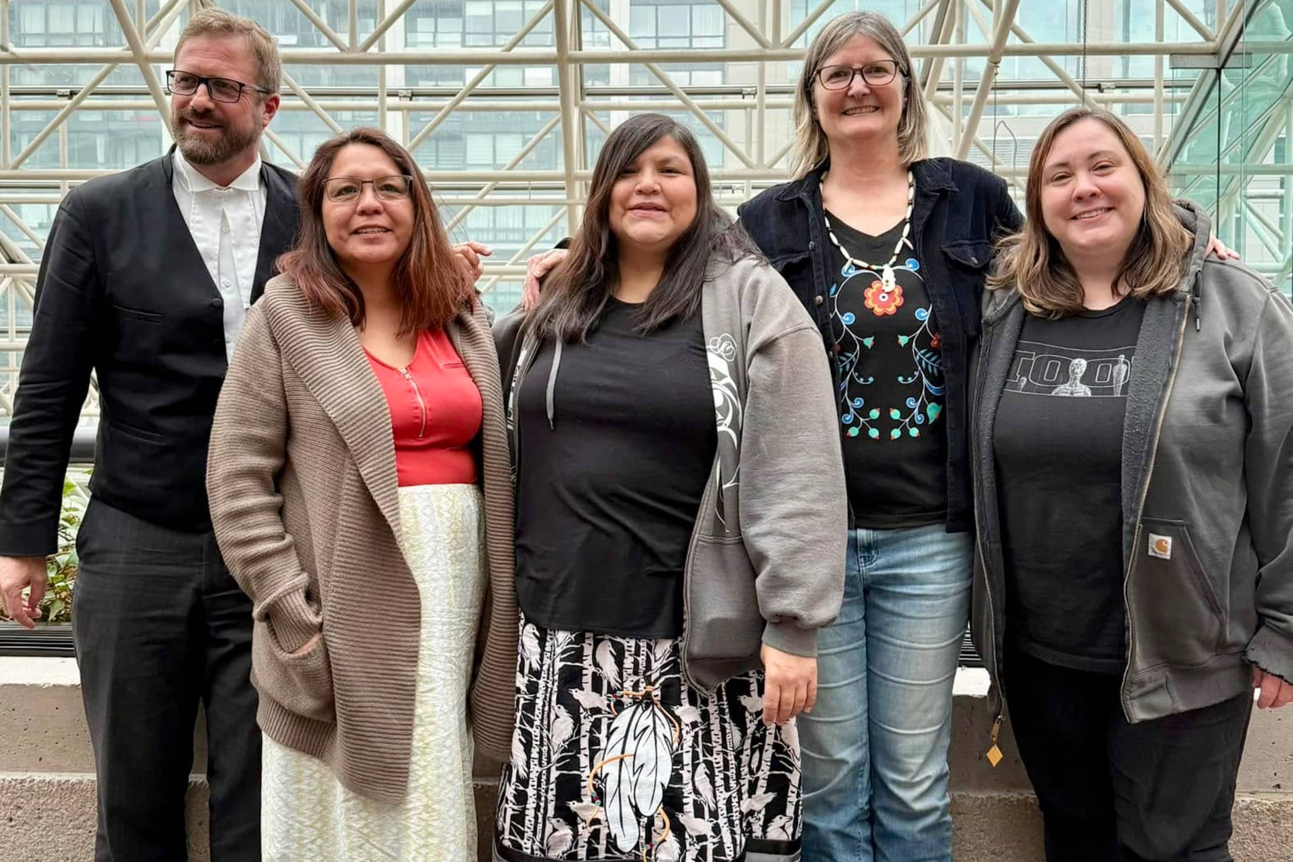 Three land defenders, arrested in 2020 for opposing the Trans Mountain pipeline in Secwépemcúl’ecw, stand with their legal counsel during the appeal hearing for their sentences in Vancouver on March 3, 2025. From left to right: Counsel Benjamin Isitt, Secwépemc land defender April Thomas, Nlaka’pamux land defender Red Deer Billie Pierre, settler-ally Romilly Cavanaugh and co-counsel Rachel Smith. Photo courtesy of April Thomas